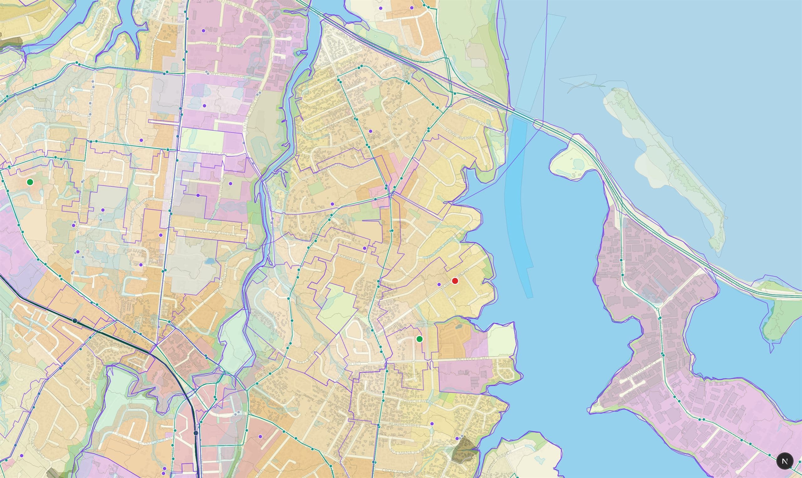 An Auckland map with flood-prone areas, landslide susceptibility, zoning, public transport routes and schools drawn as overlays beneath scored property pins.